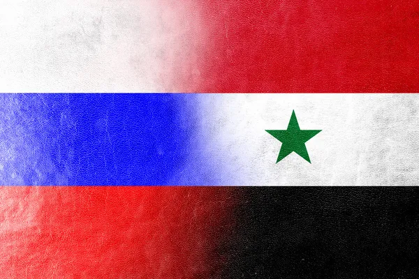 Rússia e Síria Bandeira pintada sobre textura de couro — Fotografia de Stock