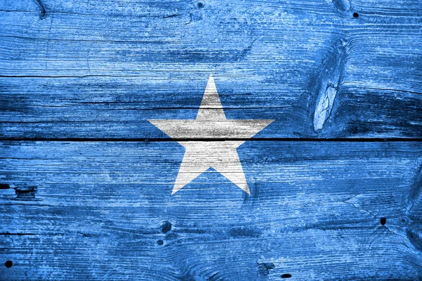 Vlajka Somálsko na staré dřevěné prkenné textury — Stock fotografie