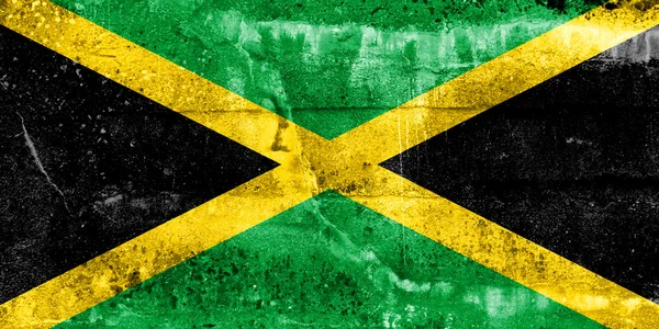 Bandeira da Jamaica pintada na parede grunge — Fotografia de Stock