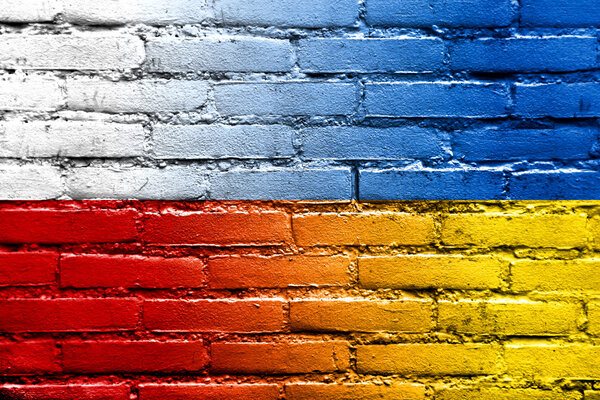 Poland and Ukraine Flag painted on brick wall