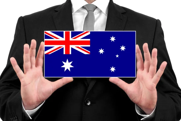 Empresario con una tarjeta de visita con bandera de Australia —  Fotos de Stock
