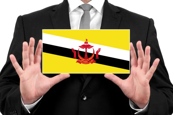 Empresario con una tarjeta de visita con bandera de Brunei — Foto de Stock