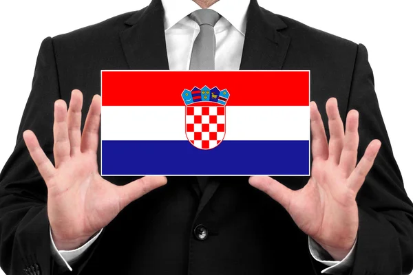 Affärsman som innehar ett visitkort med Kroatien flagga — Stockfoto