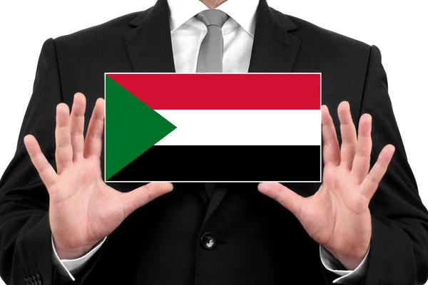Podnikatel drží vizitku s příznakem Súdán — Stock fotografie