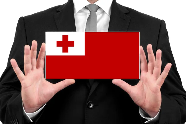 Businessman holding a business card with Tonga Flag — Stock Photo, Image