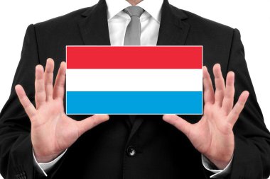 Kartvizit Lüksemburg bayrağı ile tutan işadamı