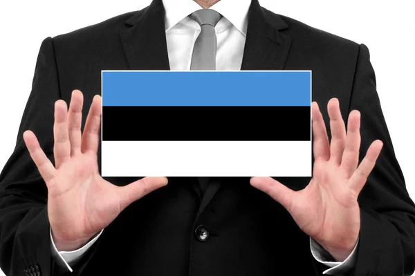 Бизнесмен, держащий визитную карточку с флагом Эстонии — стоковое фото