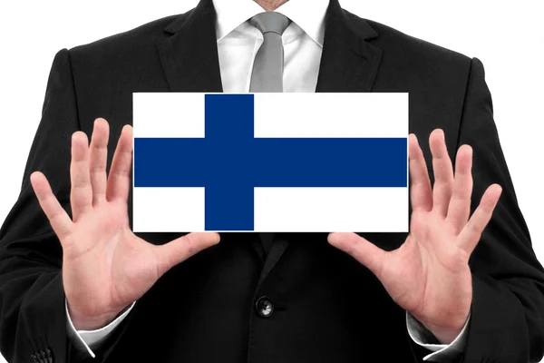 Affärsman som innehar ett visitkort med finland flagga — Stockfoto