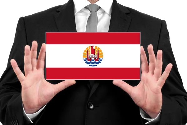 Geschäftsmann mit Visitenkarte mit französischer Polynesien-Flagge — Stockfoto