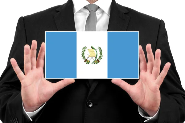 Uomo d'affari in possesso di un biglietto da visita con bandiera guatemalteca — Foto Stock