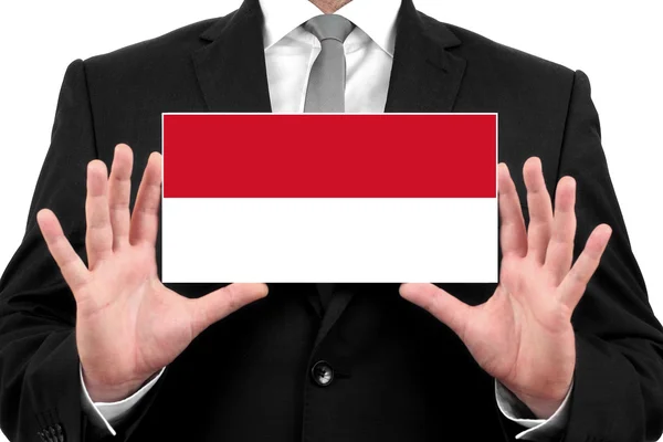 Uomo d'affari in possesso di un biglietto da visita con bandiera indonesiana — Foto Stock