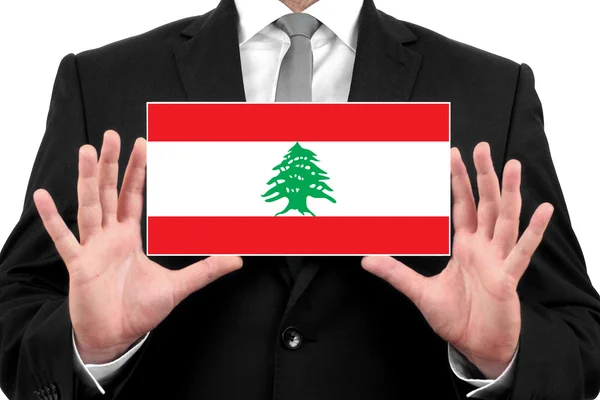 Homme d'affaires titulaire d'une carte de visite avec drapeau libanais — Photo
