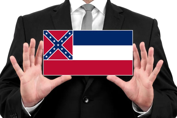 Бизнесмен с визитной карточкой под флагом штата Миссисипи — стоковое фото