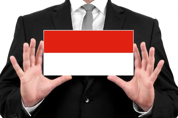 Businessman holding a business card with Monaco Flag — Stock Photo, Image