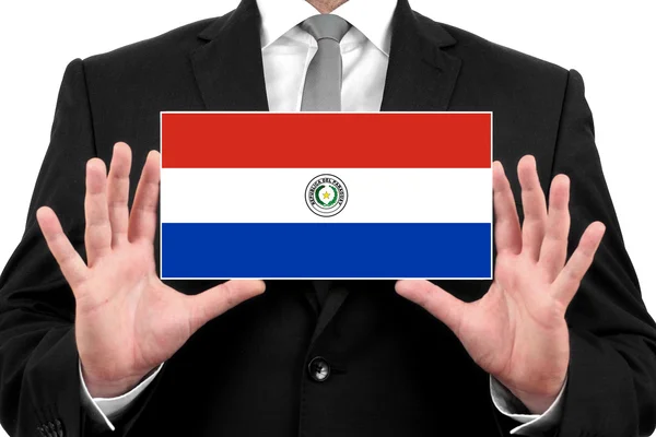 Geschäftsmann mit Visitenkarte mit paraguayischer Flagge — Stockfoto