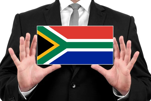 Podnikatel drží vizitku s Jižní Afrikou vlajku — Stock fotografie