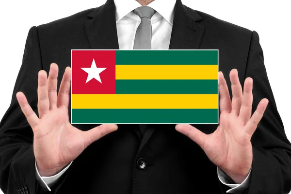 Homme d'affaires titulaire d'une carte de visite avec drapeau togolais — Photo