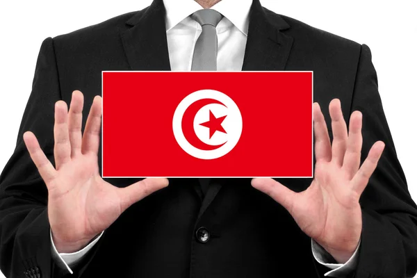 Businessman holding a business card with Tunisia Flag — Stock Photo, Image