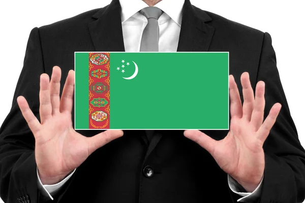 Biznesmen posiadania wizytówki z Flaga Turkmenistanu — Zdjęcie stockowe