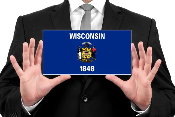 Бизнесмен с визитной карточкой под флагом Висконсина — стоковое фото