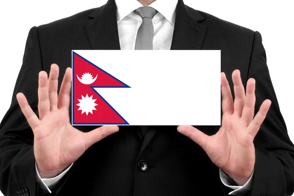 Empresario con una tarjeta de visita con bandera de Nepal —  Fotos de Stock