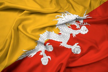 Bhutan bayrağı sallayarak