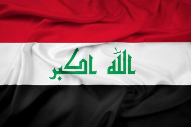 Irak bayrağı sallayarak