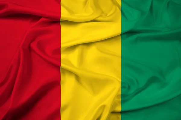 Lambaikan bendera Guinea — Stok Foto