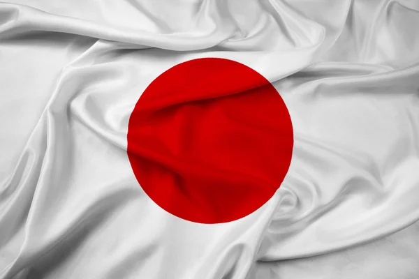 Macha flagą Japonii — Zdjęcie stockowe