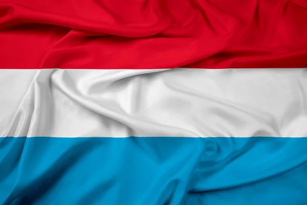 Luxemburgische Flagge schwenken — Stockfoto