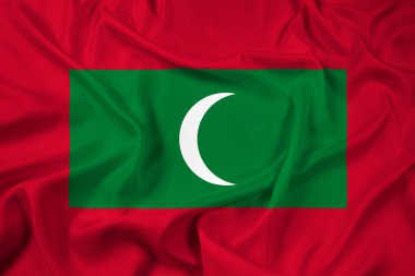 Maldivler bayrağı sallayarak