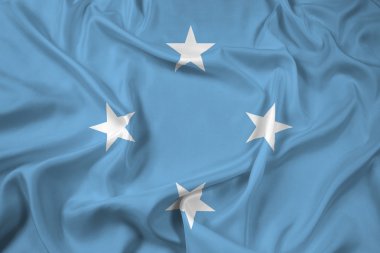 Mikronezya bayrak sallayarak