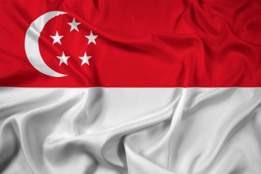 Singapur bayrağı sallayarak