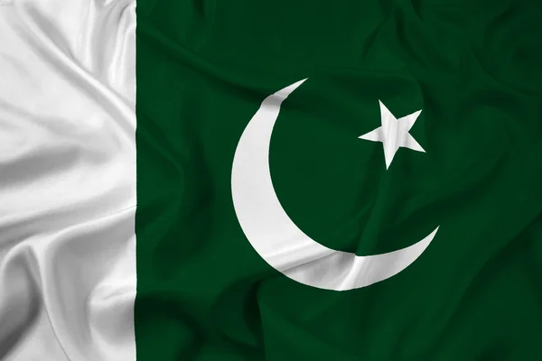 Machanie flagą Pakistanu — Zdjęcie stockowe