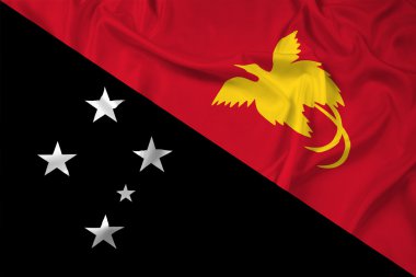 Papua Yeni Gine bayrağı sallayarak