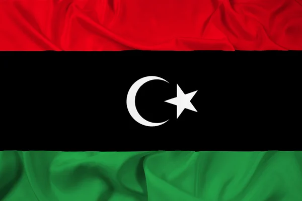 Libya bayrağı sallayarak — Stok fotoğraf