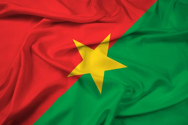 Macha flagą burkina faso — Zdjęcie stockowe