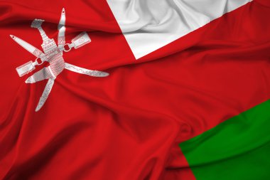 Umman bayrağı sallayarak