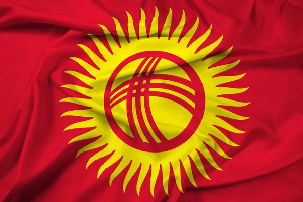 Размахивание флагом Кыргызстана — стоковое фото