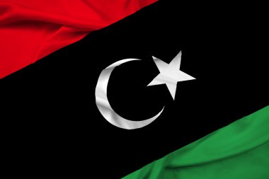Libya bayrağı sallayarak
