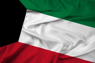 Kuveyt bayrağı sallayarak