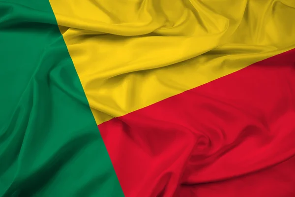 Benin bayrağı sallayarak — Stok fotoğraf