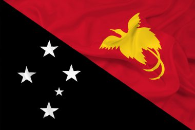 Papua Yeni Gine bayrağı sallayarak