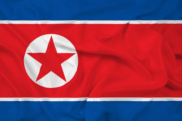 Nordkoreanische Flagge schwenken — Stockfoto