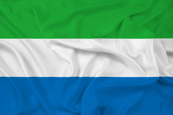 Macha flagą sierra leone — Zdjęcie stockowe