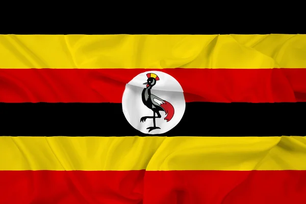 Ugandas Flagge schwenkend — Stockfoto