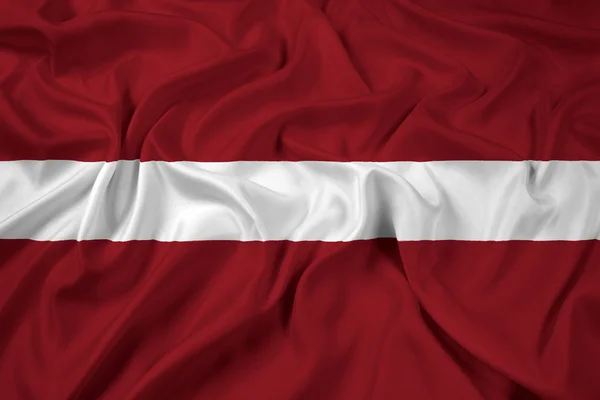 Letonya bayrağı sallayarak — Stok fotoğraf