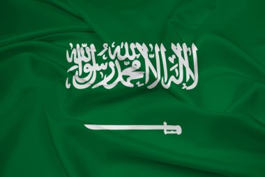 Suudi Arabistan bayrağı sallayarak
