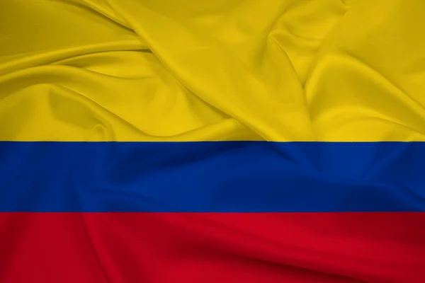 Viftar med colombia flagga — Stockfoto