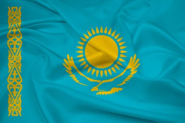Kazakistan bayrağı sallayarak